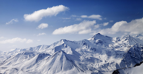 Image showing Snowy winter mountains in sun day. Panoramic view.