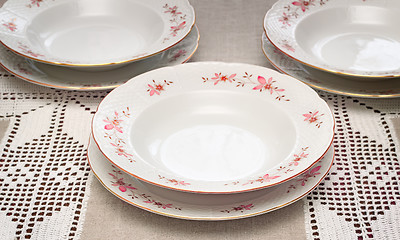 Image showing Tableware: a few white plates on the table.