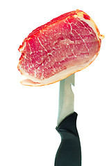 Image showing Ham on the edge of a knife on a white background.