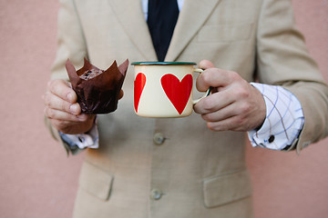 Image showing man holding hot cup of coffee