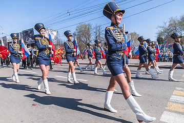 Image showing Girls in hussar form march with tags