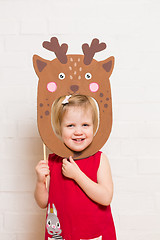 Image showing Little girls holding deer mask on white background