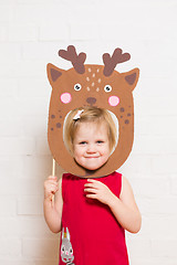 Image showing Little girls holding deer mask on white background