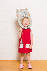 Image showing Little girls holding cat mask on white background