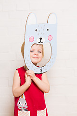 Image showing Little girls holding rabbit mask on white background