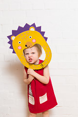 Image showing Little girls holding hedgehog mask on white background