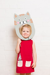 Image showing Little girls holding cat mask on white background