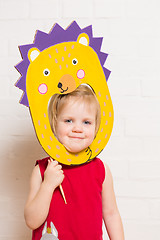 Image showing Little girls holding hedgehog mask on white background