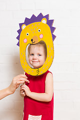 Image showing Little girls holding hedgehog mask on white background