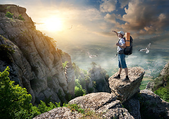 Image showing Tourist on rocks