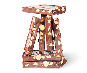 Image showing Pyramid of tiles of dark chocolate with hazelnuts