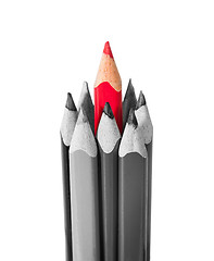 Image showing Red pencil surrounded by black and white pencils