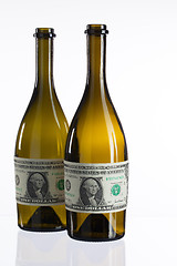 Image showing Empty bottles of wine from the label of dollar bill 