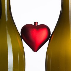 Image showing Empty bottles of wine and romantic symbol