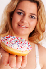 Image showing Colorful muffin in hand