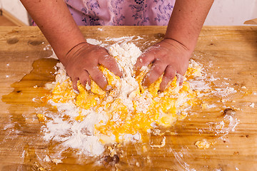 Image showing Hands kneading a dough