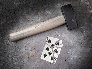 Image showing Hammer with a broken card, eight of spades