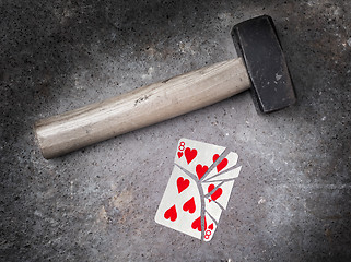 Image showing Hammer with a broken card, eight of hearts