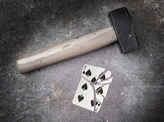 Image showing Hammer with a broken card, seven of spades