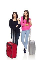 Image showing Two friends girls with travel suitcases