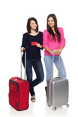 Image showing Two friends girls with travel suitcases