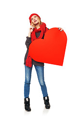 Image showing Full length girl holding up a red cardboard heart