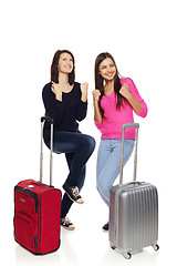 Image showing Two friends girls with travel suitcases