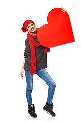 Image showing Full length girl holding up a red cardboard heart