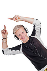 Image showing Young handsome man dancing with headphones 