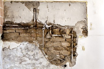 Image showing Damaged wall plumbing