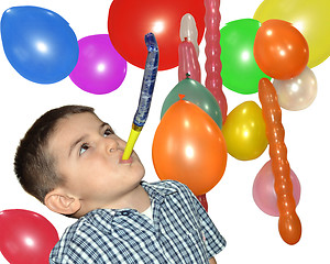 Image showing Happy boy play with air whistle