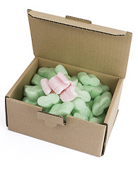 Image showing packaging box with green foam and some pink ones