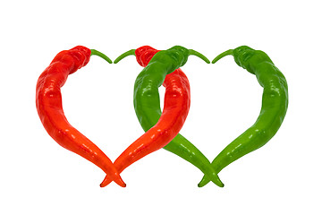 Image showing Red and green chili peppers in love. Hearts composed of peppers.