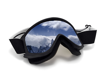 Image showing Ski goggles with reflection of cloudy mountains