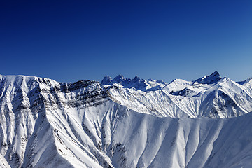 Image showing Snowy rocks in winter sun day