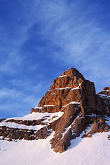 Image showing Snowy sunlight rocks at sunrise