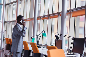 Image showing African American businessman talk by phone