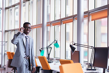 Image showing African American businessman talk by phone