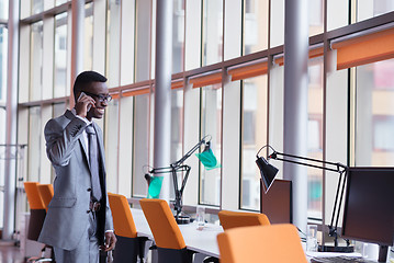 Image showing African American businessman talk by phone