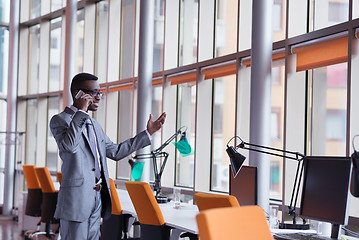 Image showing African American businessman talk by phone