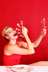 Image showing Happy Woman Holding a Fan of Fork and Wine Glass