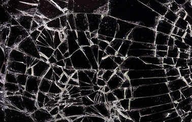 Image showing Full screen broken glass, black background 