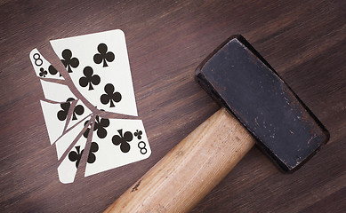 Image showing Hammer with a broken card, eight of clubs