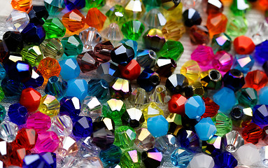 Image showing Beautiful glass beads closeup on white background