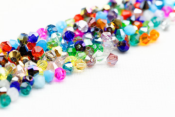 Image showing Beautiful glass beads closeup on white background