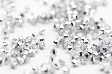 Image showing Beautiful glass beads closeup on white background