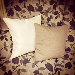 Image showing Cushions decorating a sofa with floral design