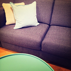 Image showing Green coffee table and sofa with cushions