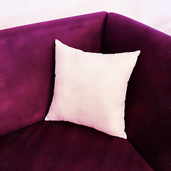 Image showing Fancy purple sofa with white cushion