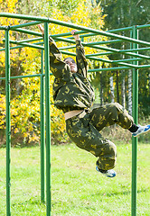 Image showing Teenage girl on climbing frame in relay